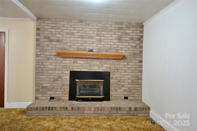 room details featuring baseboards, a brick fireplace, carpet flooring, and crown molding