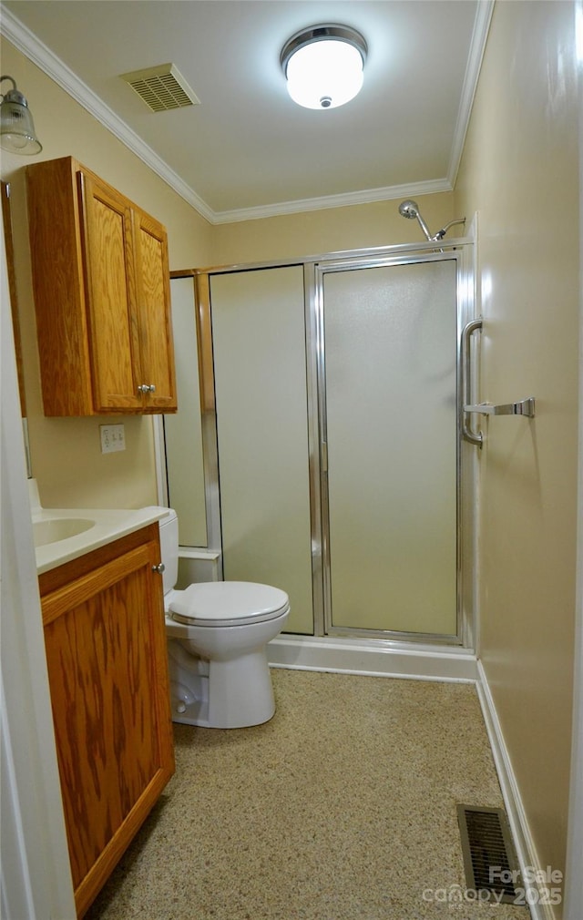 bathroom with visible vents, crown molding, and a shower with shower door