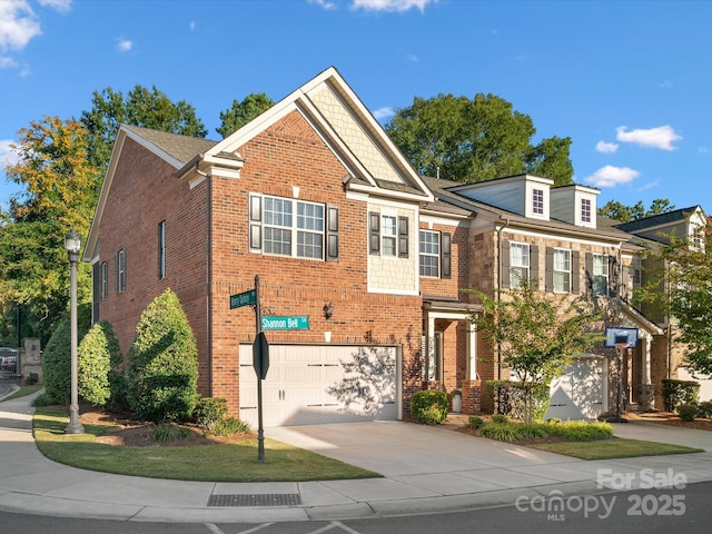 view of front facade with driveway, a garage, and brick siding