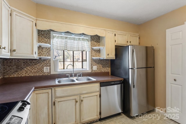 kitchen with open shelves, tasteful backsplash, dark countertops, appliances with stainless steel finishes, and a sink