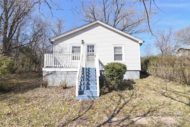 exterior space with a deck and stairs