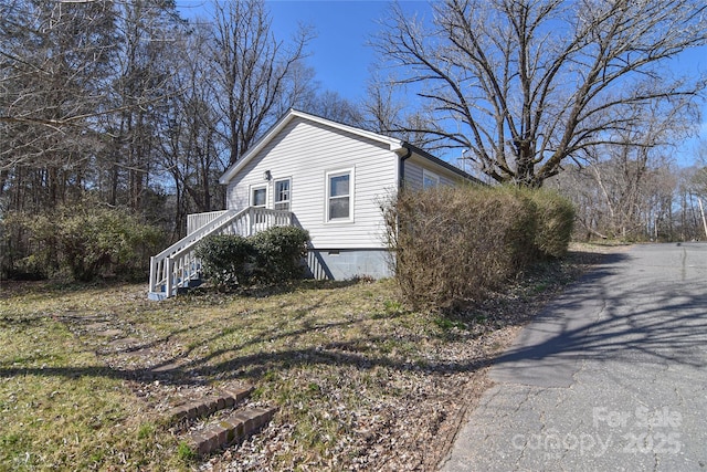 view of home's exterior with crawl space