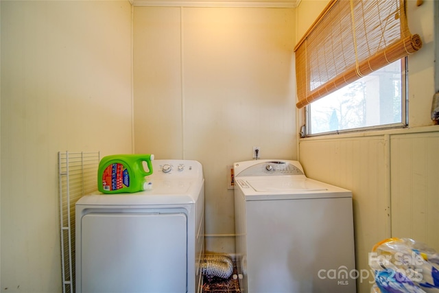 clothes washing area with laundry area and washing machine and clothes dryer