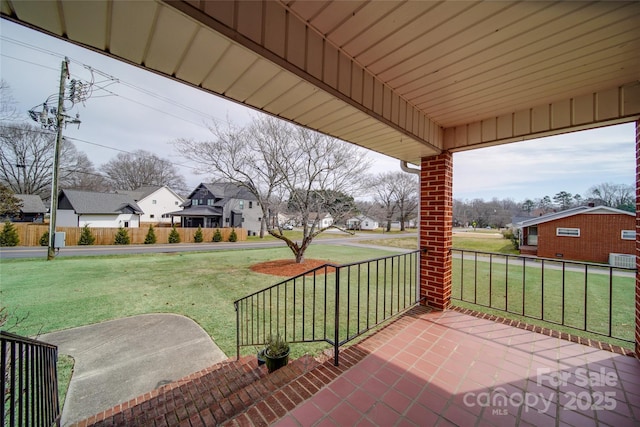 view of patio / terrace with covered porch and a residential view