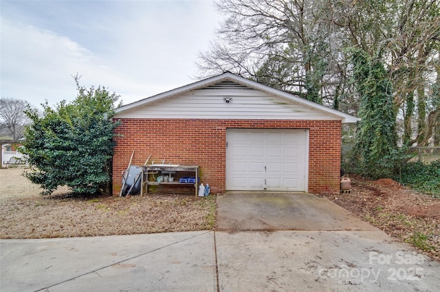 garage featuring driveway