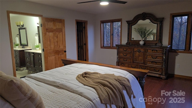 bedroom with ensuite bath, baseboards, ceiling fan, and wood finished floors