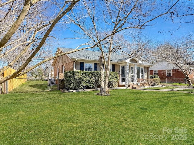 single story home with brick siding, a front lawn, fence, and a gate