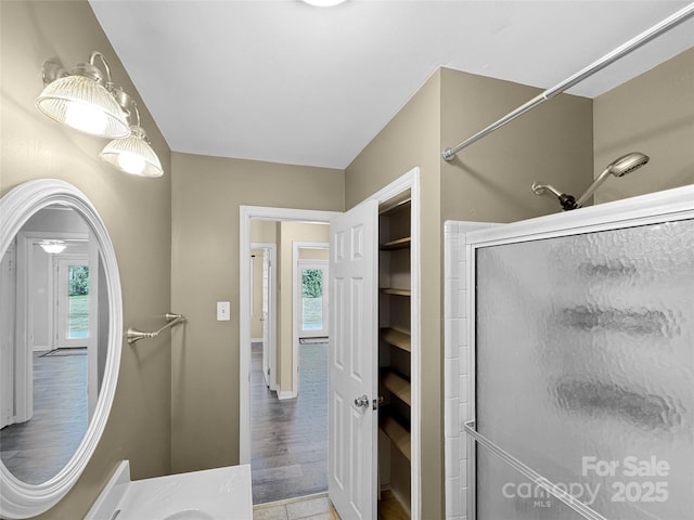 full bathroom featuring a shower stall and vanity