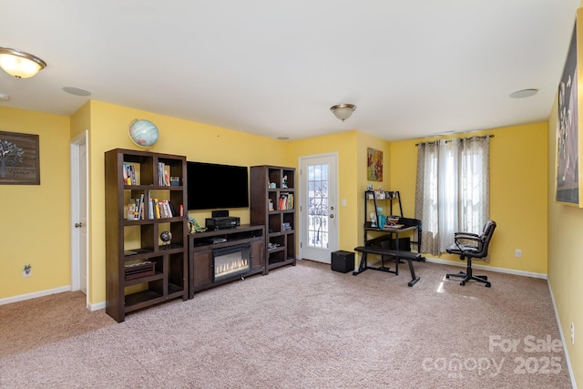 sitting room with carpet flooring and baseboards