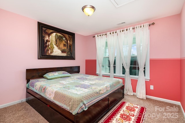 bedroom featuring carpet floors, baseboards, and visible vents