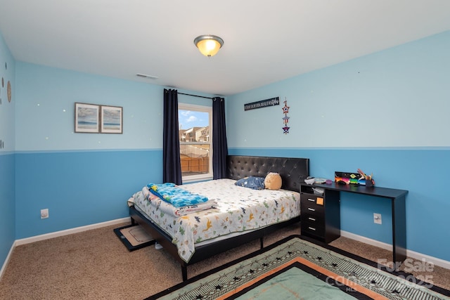 carpeted bedroom with baseboards and visible vents