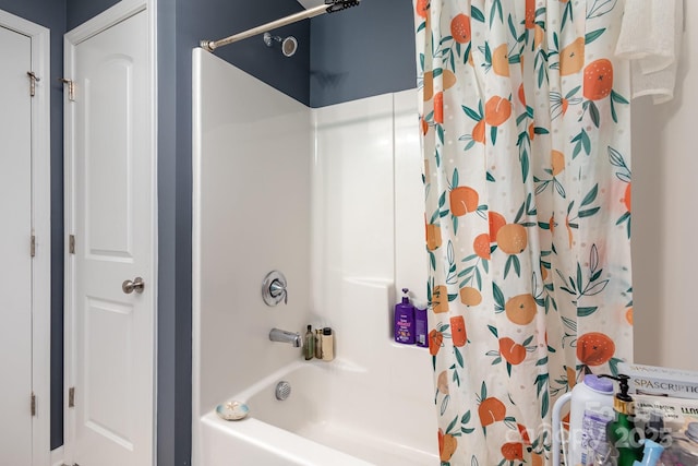 bathroom with shower / bath combination with curtain