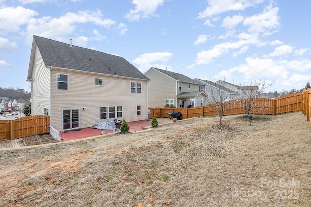 back of house with a patio area, a fenced backyard, and a residential view