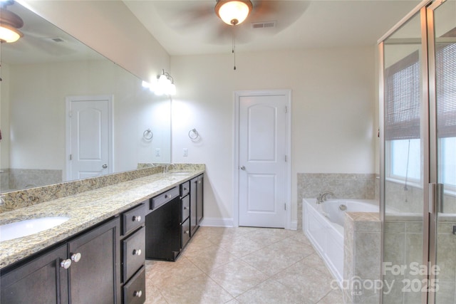 full bath with ceiling fan, tile patterned floors, a sink, and double vanity