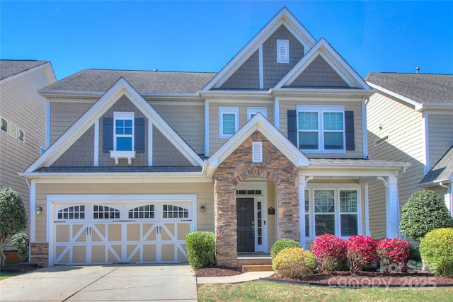 craftsman inspired home featuring an attached garage, driveway, stone siding, and a shingled roof