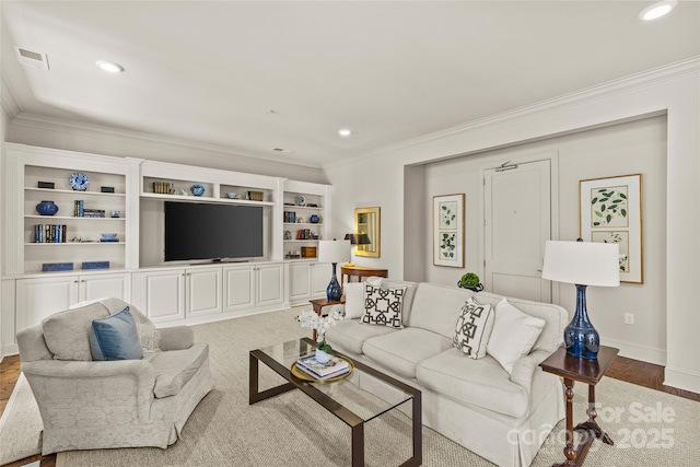 living area featuring recessed lighting, visible vents, and ornamental molding