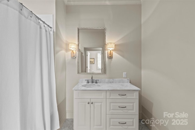 bathroom featuring vanity and baseboards