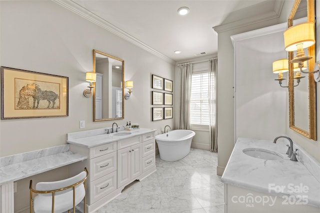 bathroom with crown molding, marble finish floor, a sink, and a freestanding bath