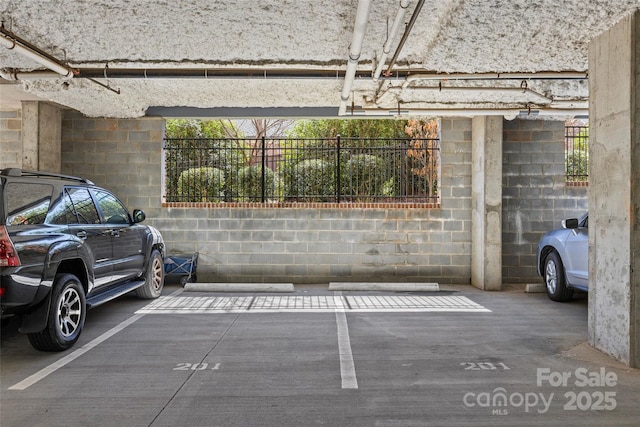 parking garage featuring fence