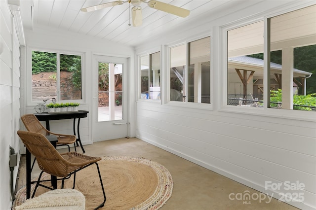 sunroom / solarium featuring wood ceiling and ceiling fan