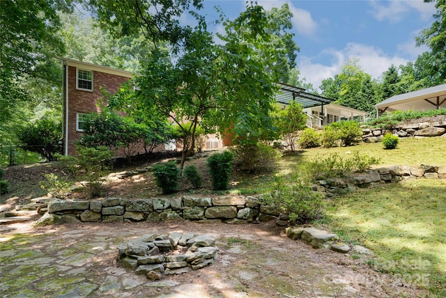 view of yard with a fire pit