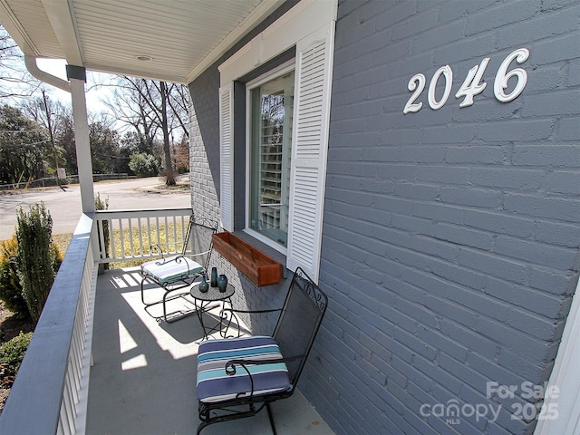 balcony featuring a porch