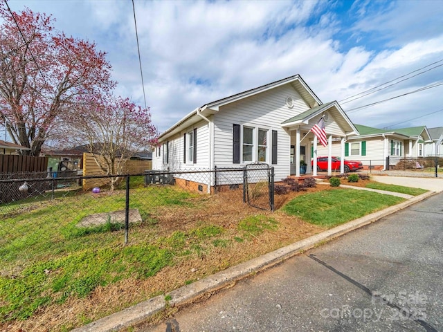 view of front of house featuring crawl space, covered porch, a front yard, and fence