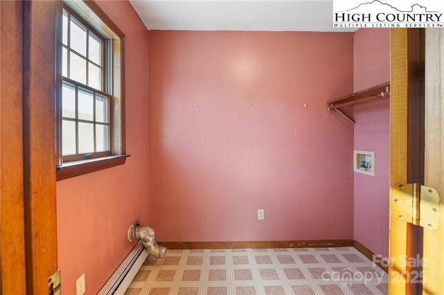 laundry area with washer hookup, laundry area, baseboards, and light floors