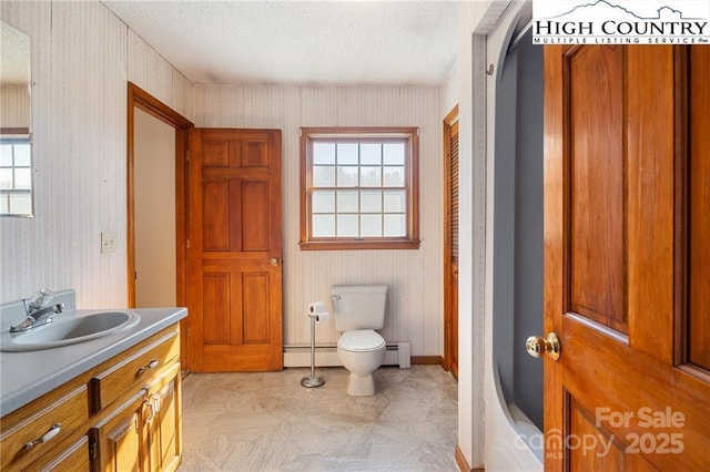 bathroom featuring wallpapered walls, toilet, a baseboard radiator, vanity, and a baseboard heating unit