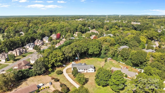 bird's eye view featuring a forest view