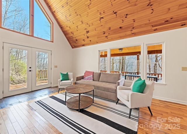 living room featuring french doors, hardwood / wood-style floors, high vaulted ceiling, wooden ceiling, and baseboards