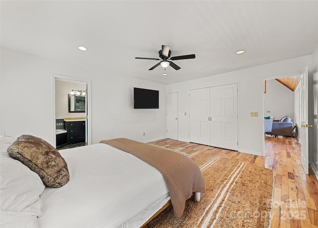 bedroom featuring recessed lighting, a closet, light wood-style flooring, a ceiling fan, and baseboards