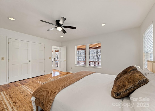 bedroom featuring multiple windows, a ceiling fan, wood finished floors, and recessed lighting