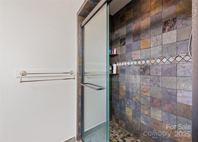 bathroom with a shower stall