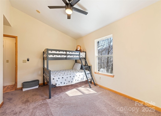 bedroom featuring ceiling fan, baseboards, vaulted ceiling, and carpet flooring