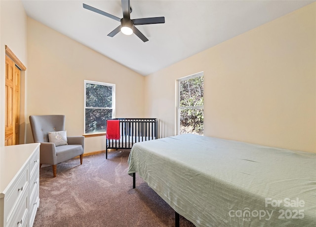 bedroom with carpet floors, multiple windows, vaulted ceiling, and a ceiling fan