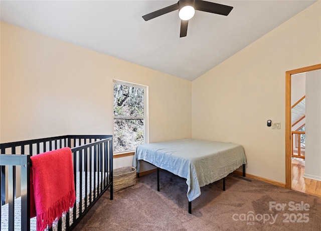 bedroom featuring lofted ceiling, carpet, a ceiling fan, and baseboards