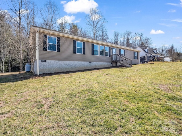 manufactured / mobile home with a front lawn and crawl space