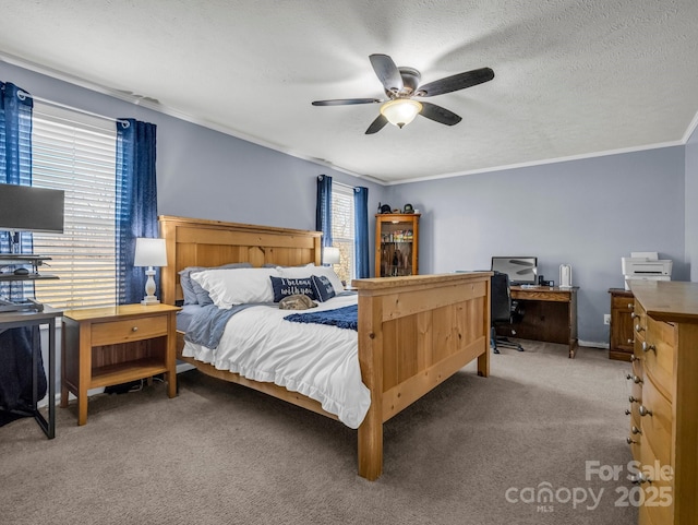 bedroom featuring carpet, a textured ceiling, a ceiling fan, and crown molding