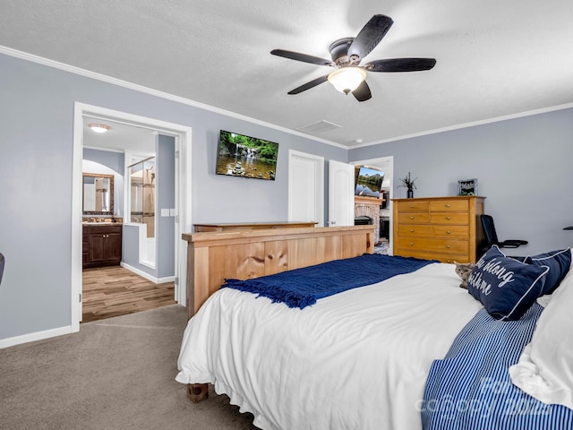 bedroom with crown molding, carpet flooring, ceiling fan, a textured ceiling, and baseboards