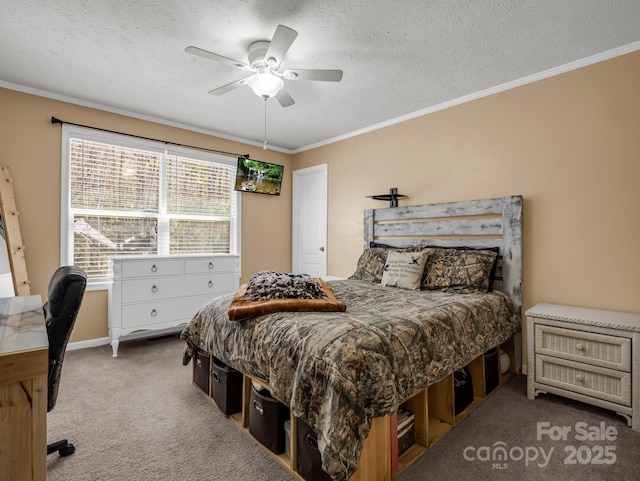 carpeted bedroom featuring ornamental molding, a textured ceiling, and a ceiling fan