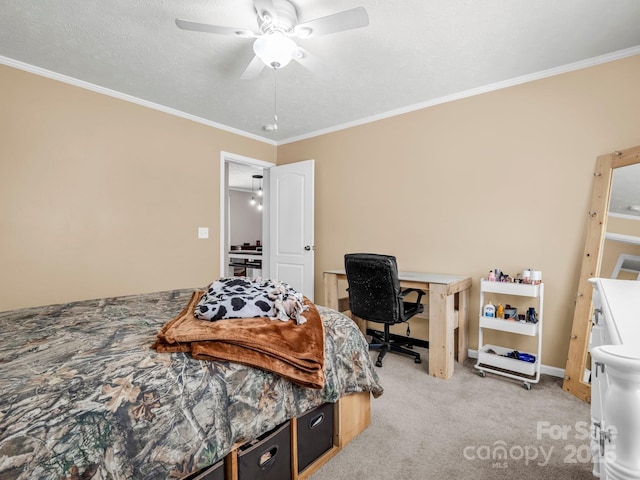 bedroom with baseboards, a ceiling fan, light colored carpet, ornamental molding, and a textured ceiling