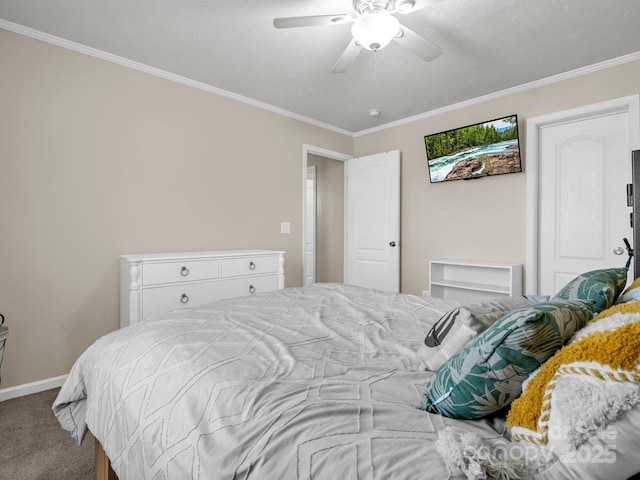 bedroom featuring baseboards, a ceiling fan, ornamental molding, a textured ceiling, and carpet floors