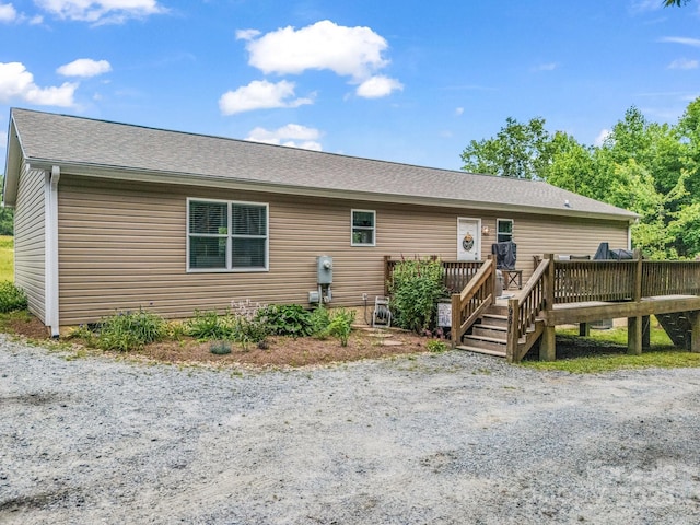 981 Gilliam Mountain Rd, Hendersonville, NC 28792 - back of property with a deck and a shingled roof