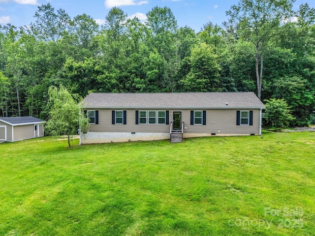 981 Gilliam Mountain Rd, Hendersonville, NC 28792 - view of front of house featuring a front lawn, crawl space, and an outbuilding
