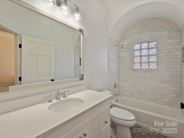 full bath featuring vanity, shower / tub combination, and toilet