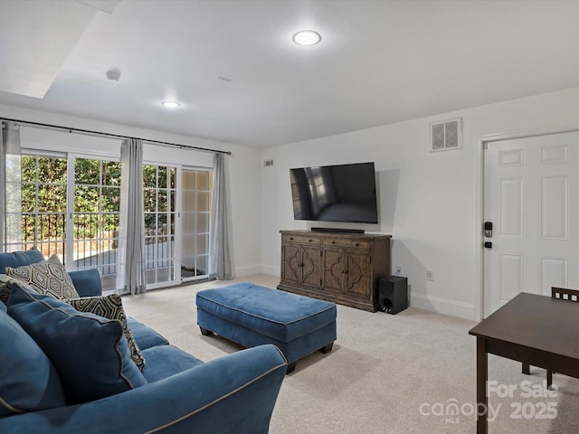 living area with carpet, visible vents, baseboards, and recessed lighting