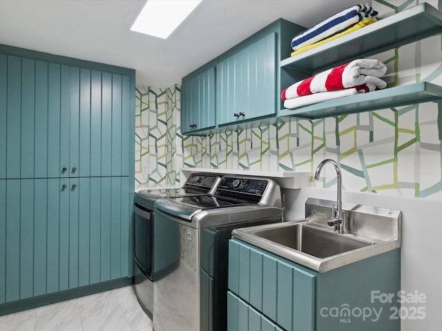 washroom with laundry area, marble finish floor, and separate washer and dryer