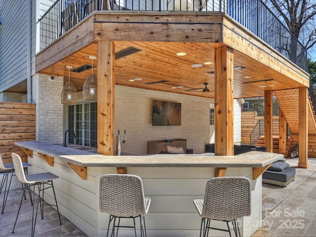 view of patio / terrace with stairway and outdoor dry bar