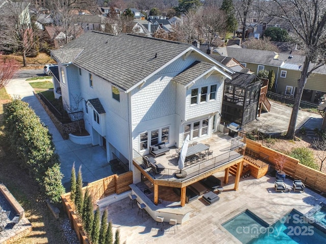 back of house with stairway, fence, and a deck